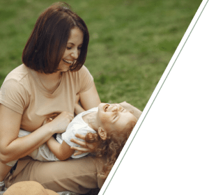 A joyful mother and child outdoors, representing personalized care from a child psychologist in San Francisco.