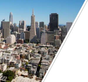 Wide skyline view of San Francisco city showing dense buildings, urban movement, and a calm professional atmosphere tone