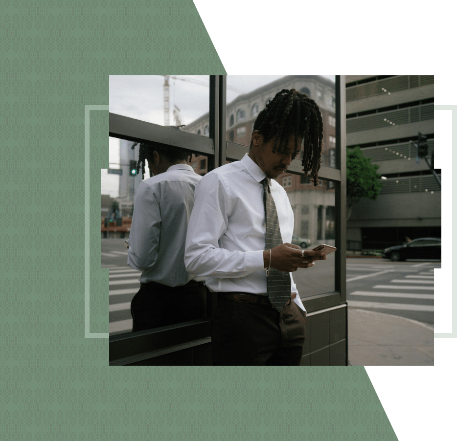 Man in San Francisco looking at phone, searching for the best therapist San Francisco offers.