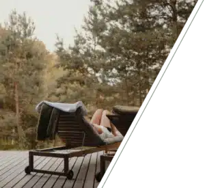 A person lounges on a deck