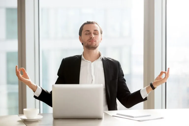 businessman relieves work stress with meditation
