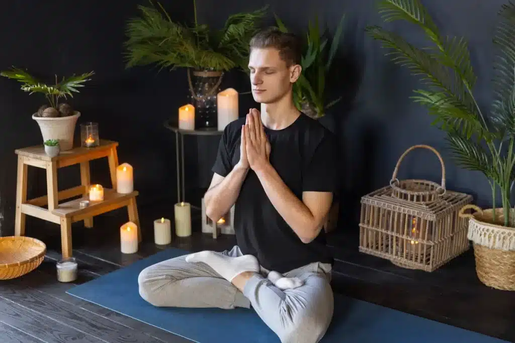 man doing yoga indoors