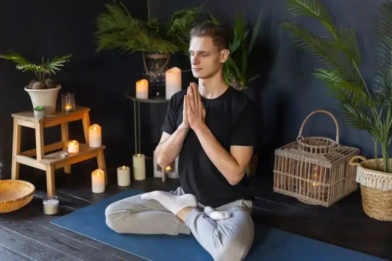 man doing yoga indoors