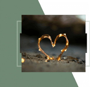 Close-up of two people holding hands, one wearing an engagement ring