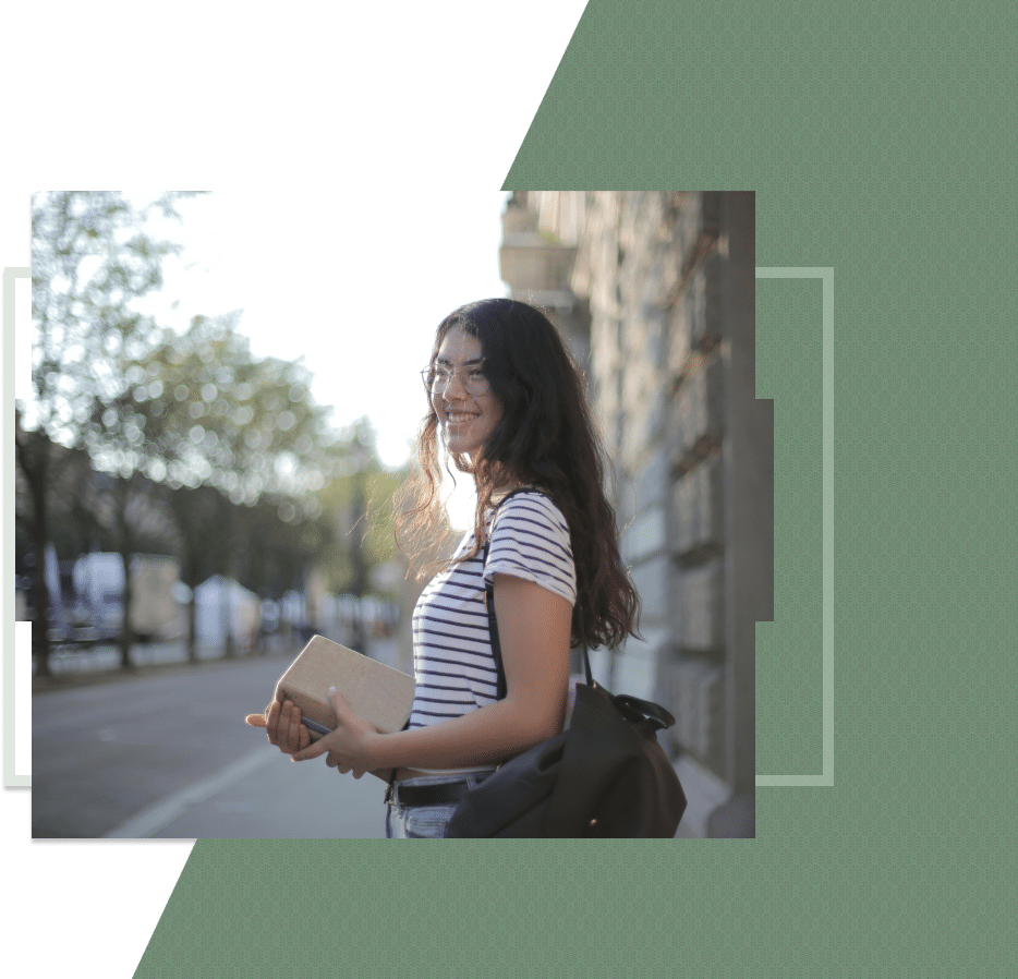A smiling girl standing on the road