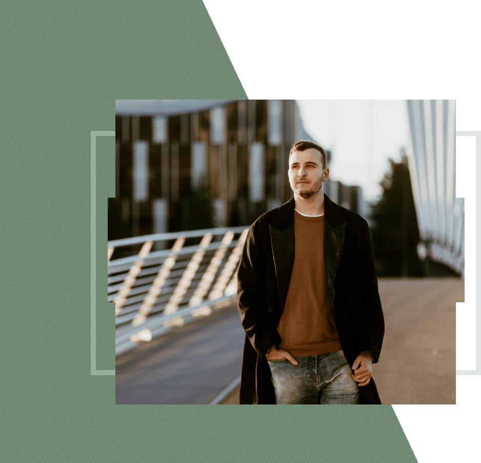 A smiling man having his picture taken by someone else