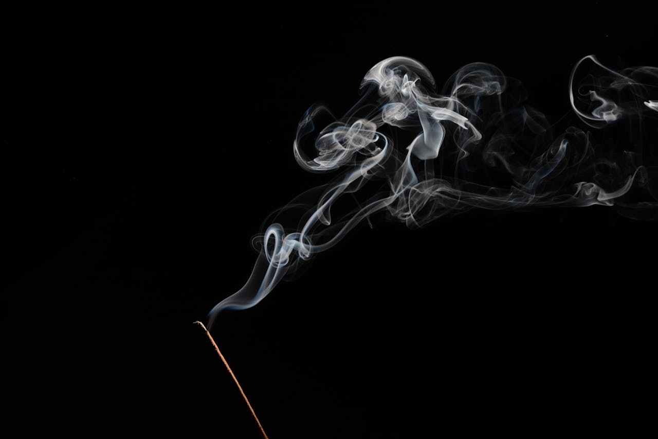 Smoke drifting upward representing experimentation with substances and the early warning signs of addiction.