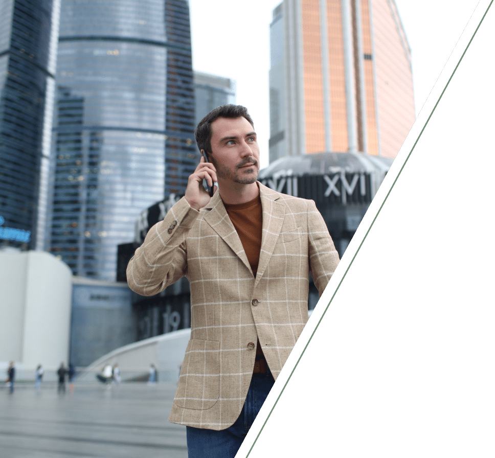 Man holding phone with city buildings behind reflecting daily life challenges connection and urban environment stress