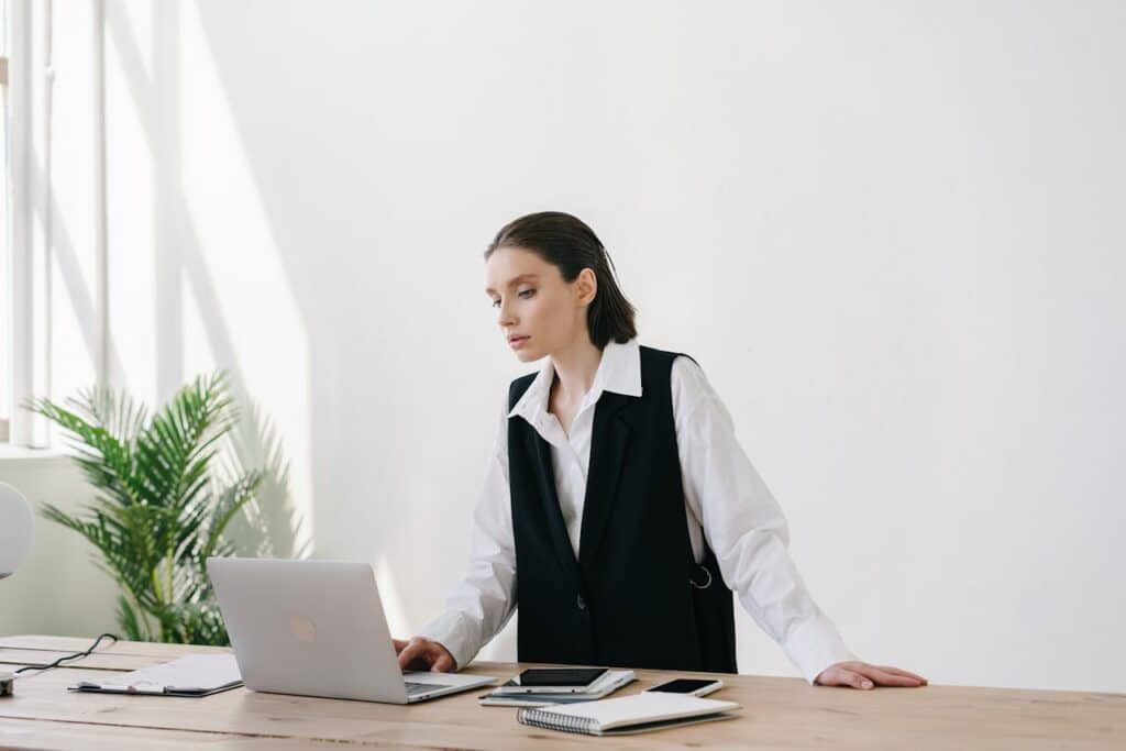 woman working on laptop managing startup stress in office environment