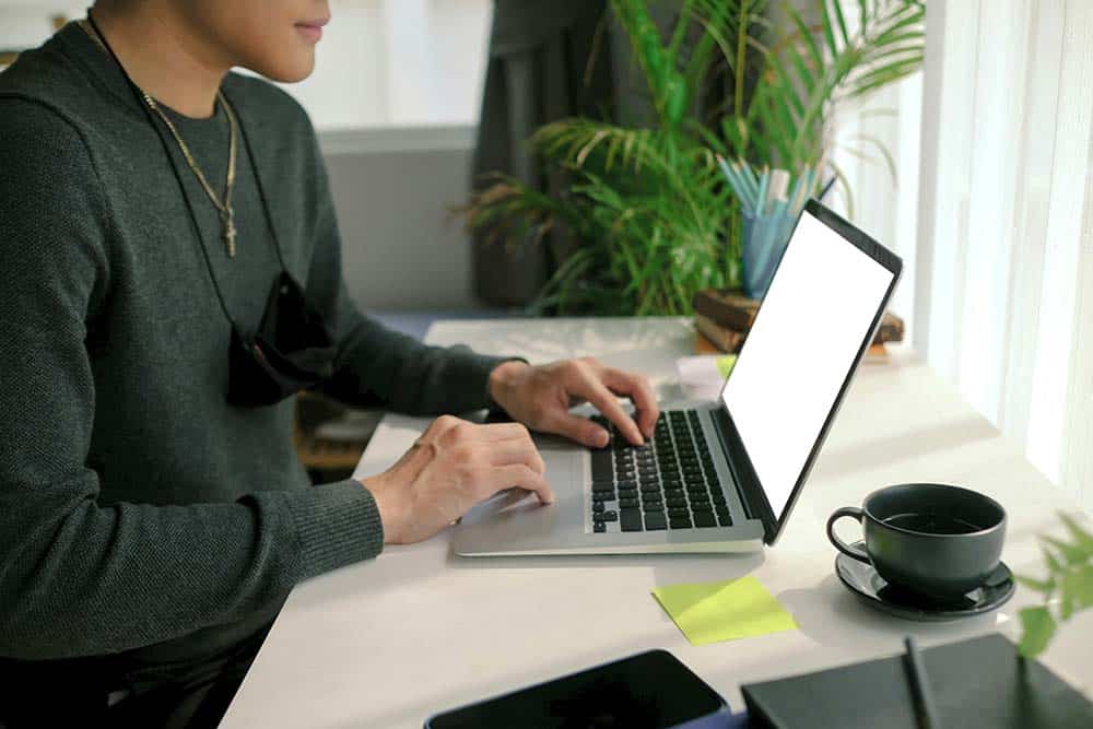 side-view-of-young-man-using-computer-laptop