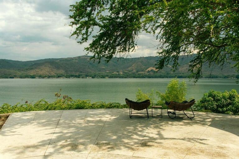 Scenic view of a lake with outdoor seating