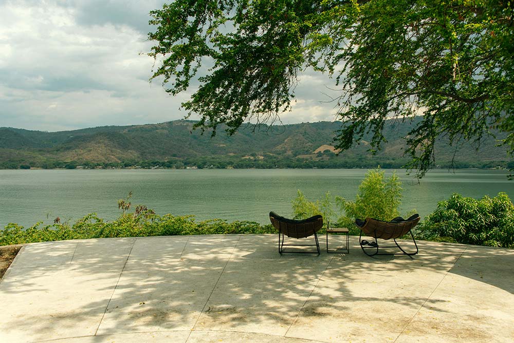 Scenic view of a lake with outdoor seating
