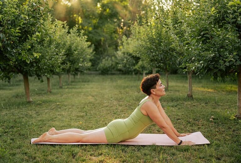 Woman performing cobra yoga pose